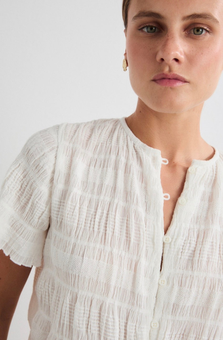 Mus and Bombon Cotton and recycled blend shirred crop top.
